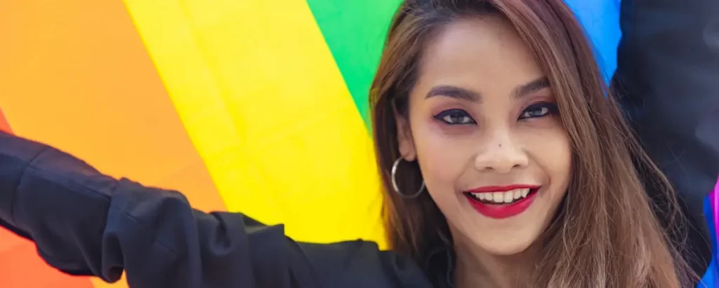 Ladyboy dating in the united states - holding LGBTQ flag